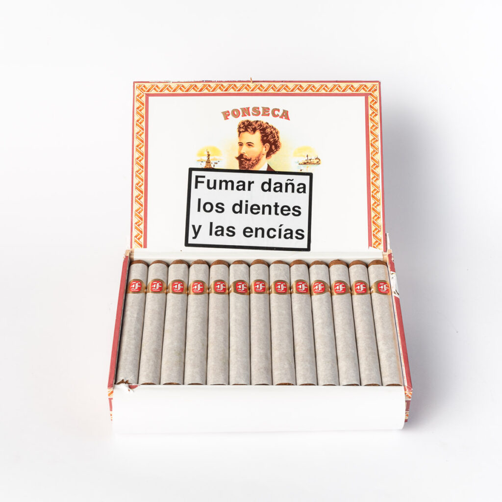 Fonseca cigars in elegant white packaging with red accents.