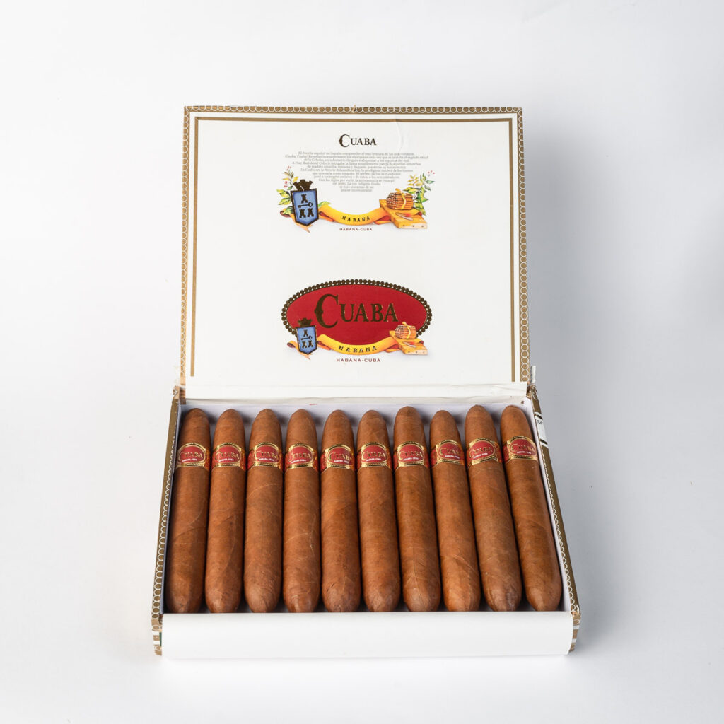 Cuaba Cuban cigars in elegant open box, rich amber-brown hue.