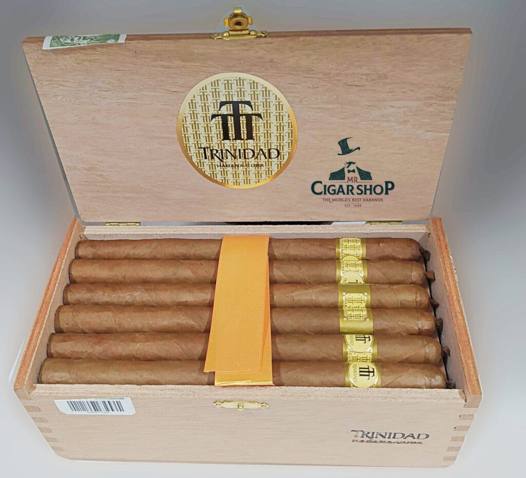 Trinidad cigars in an elegant wooden box with golden branding.