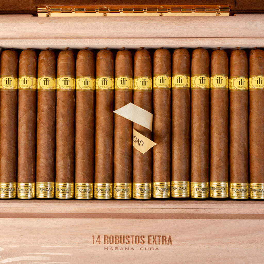 Trinidad Robustos Extra cigars in a polished wooden box.