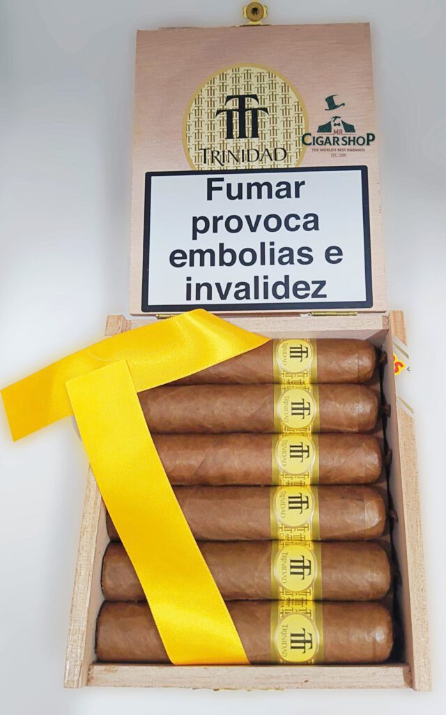 Trinidad cigars in a wooden box with yellow ribbon.
